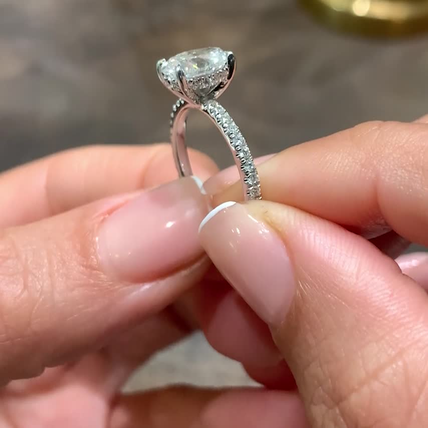 Oval diamond ring on sale with hidden halo